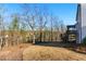 Expansive backyard with a gentle slope, complemented by trees and the side of the home at 20 Running Nw Ter, Cartersville, GA 30121