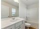 Bathroom featuring a vanity with white marble countertop, sink and a large mirror at 20 Running Nw Ter, Cartersville, GA 30121