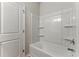 Bright bathroom showcasing a clean, white tub and shower combo with built-in shelving at 20 Running Nw Ter, Cartersville, GA 30121