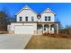 Charming two-story home features a two-car garage, inviting front porch, and pristine lawn at 20 Running Nw Ter, Cartersville, GA 30121