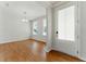 Bright, open-concept living room with wood floors, chandelier and neutral walls at 20 Running Nw Ter, Cartersville, GA 30121