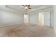 Primary bedroom featuring neutral carpet and doors to both the closet and bathroom at 20 Running Nw Ter, Cartersville, GA 30121