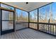 Relaxing screened porch with wooden floors and a view of the surrounding trees at 20 Running Nw Ter, Cartersville, GA 30121