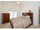 Bedroom with a double bed and a dark wood dresser with an arched window at 305 Collegiate Dr, Powder Springs, GA 30127
