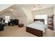 A bedroom with a ceiling fan, a bed with a bookshelf headboard, and a desk in the corner at 305 Collegiate Dr, Powder Springs, GA 30127