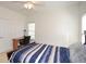 Bedroom featuring neutral walls and carpet, ceiling fan, and a desk at 305 Collegiate Dr, Powder Springs, GA 30127