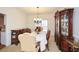 Elegant dining area with a detailed china cabinet, stylish chairs, and neutral decor at 305 Collegiate Dr, Powder Springs, GA 30127