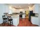 Bright kitchen with granite countertops, tile backsplash, white cabinetry and stainless steel appliances at 305 Collegiate Dr, Powder Springs, GA 30127