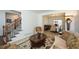Comfortable living area with a staircase, elegant furnishings, and an open layout to the dining room at 305 Collegiate Dr, Powder Springs, GA 30127