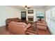 Spacious living room with hardwood floors, fireplace, media center, and natural light at 305 Collegiate Dr, Powder Springs, GA 30127