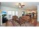 Spacious living room with hardwood floors, fireplace, media center, and open floor plan at 305 Collegiate Dr, Powder Springs, GA 30127