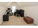 Office space with a desk, chair, filing cabinets and a leather ottoman on carpeted floor at 305 Collegiate Dr, Powder Springs, GA 30127