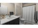 Stylish bathroom features a modern vanity, sleek fixtures, and a shower with curtain at 4336 Walsh Dr, Dunwoody, GA 30338