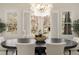 Bright dining area offering views of the yard through shuttered windows and showcasing modern decor at 4336 Walsh Dr, Dunwoody, GA 30338