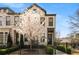 Two-story townhome features beautiful landscaping, gated yard, and a classic brick facade at 4336 Walsh Dr, Dunwoody, GA 30338