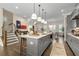 Bright kitchen boasting a central island, stainless appliances, and easy access to both living and dining areas at 4336 Walsh Dr, Dunwoody, GA 30338