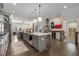 Spacious kitchen with a large island, stainless steel appliances, and an open view of the living area at 4336 Walsh Dr, Dunwoody, GA 30338