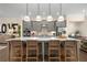 Stylish kitchen island featuring pendant lighting, seating, and ample counter space for cooking and entertaining at 4336 Walsh Dr, Dunwoody, GA 30338