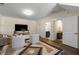 Bright living room with modern furnishings, decorative rug, and a large-screen television at 4336 Walsh Dr, Dunwoody, GA 30338