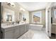 Beautiful main bathroom with double vanity, modern soaking tub, and natural light at 4336 Walsh Dr, Dunwoody, GA 30338