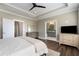 Spacious main bedroom featuring a ceiling fan, ensuite bathroom, and natural light at 4336 Walsh Dr, Dunwoody, GA 30338