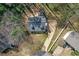 Bird's-eye view of the house highlighting the driveway, backyard, and surrounding trees at 4382 Conwhey Sw Ct, Smyrna, GA 30082