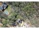 Aerial view of the home within a wooded neighborhood, near a community pool at 4382 Conwhey Sw Ct, Smyrna, GA 30082