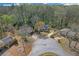 Aerial view of the property showcasing the home's location within a wooded neighborhood at 4382 Conwhey Sw Ct, Smyrna, GA 30082