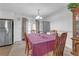 Cozy dining area with a table for four, traditional wood chairs, and ample natural light, perfect for Gathering meals at 4382 Conwhey Sw Ct, Smyrna, GA 30082