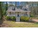 Inviting two-story home with a welcoming front porch, garden, and well-maintained lawn in a serene neighborhood at 4382 Conwhey Sw Ct, Smyrna, GA 30082