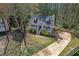 Charming home with a front porch, manicured landscaping, and a long driveway at 4382 Conwhey Sw Ct, Smyrna, GA 30082