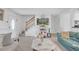 Bright living room with a staircase, neutral carpet, comfortable seating and natural light streaming through the front door at 4382 Conwhey Sw Ct, Smyrna, GA 30082