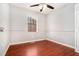 Bedroom with hardwood floors and natural light from the window at 6962 Oakhill Cir, Austell, GA 30168