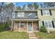 Charming townhome featuring a brick facade, covered porch, and a well-maintained front yard at 6962 Oakhill Cir, Austell, GA 30168