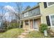 Attractive townhome boasting a covered entry, brick accents, and a quaint front garden at 6962 Oakhill Cir, Austell, GA 30168