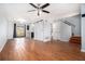 Open-concept living area featuring modern floors, a sliding barn door, and plenty of natural light at 6962 Oakhill Cir, Austell, GA 30168