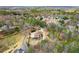 The house is situated on a verdant lot surrounded by lush trees in a well-established neighborhood at 2845 Echols Rd, Cumming, GA 30041