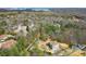 An aerial view shows the property is nestled among trees and other homes in a charming neighborhood at 2845 Echols Rd, Cumming, GA 30041