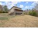 Exterior showcasing a spacious backyard with a multi-level deck and screened-in porch at 2845 Echols Rd, Cumming, GA 30041