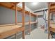 Unfinished basement featuring custom shelving for additional storage at 2845 Echols Rd, Cumming, GA 30041