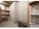 Unfinished basement storage area with wooden shelving units at 2845 Echols Rd, Cumming, GA 30041