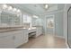 Bright bathroom featuring dual sinks, granite countertops, and a walk-in shower and natural light at 2845 Echols Rd, Cumming, GA 30041