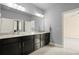 Bright bathroom featuring double vanity with granite counters and modern fixtures, plus a separate water closet at 2845 Echols Rd, Cumming, GA 30041