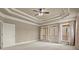 Large bedroom with a tray ceiling, and French doors leading to a porch at 2845 Echols Rd, Cumming, GA 30041
