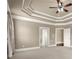 Bedroom boasting a tray ceiling, neutral walls, carpeted floors and access to adjacent rooms at 2845 Echols Rd, Cumming, GA 30041