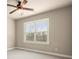 Cozy bedroom featuring a large window bringing in ample natural light and neutral colored walls at 2845 Echols Rd, Cumming, GA 30041