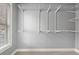 Walk-in closet with wire shelving system for organization and ample storage space by the window at 2845 Echols Rd, Cumming, GA 30041
