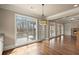 Sunny dining area featuring hardwood floors, large windows, and outdoor access at 2845 Echols Rd, Cumming, GA 30041