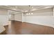 Bright dining room features hardwood floors, chair rail, and modern chandelier at 2845 Echols Rd, Cumming, GA 30041