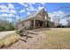 Traditional style home with a front porch, side entry garage, and a sloped front yard at 2845 Echols Rd, Cumming, GA 30041